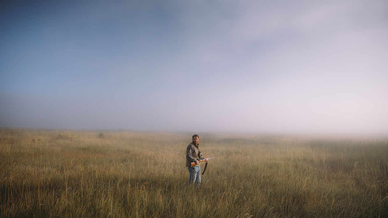Wyoming Department of Corrections hunter in field of grass