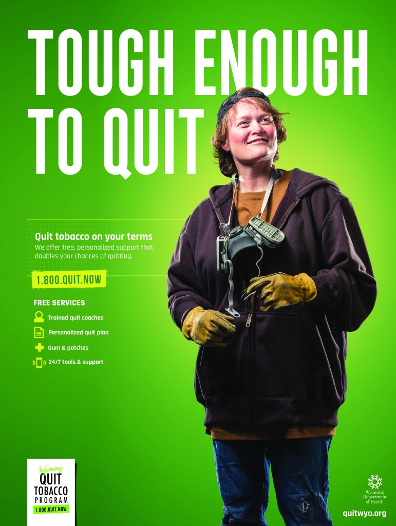 Poster for Wyoming Quit Tobacco campaign showing a woman welder with text tough enough to quit